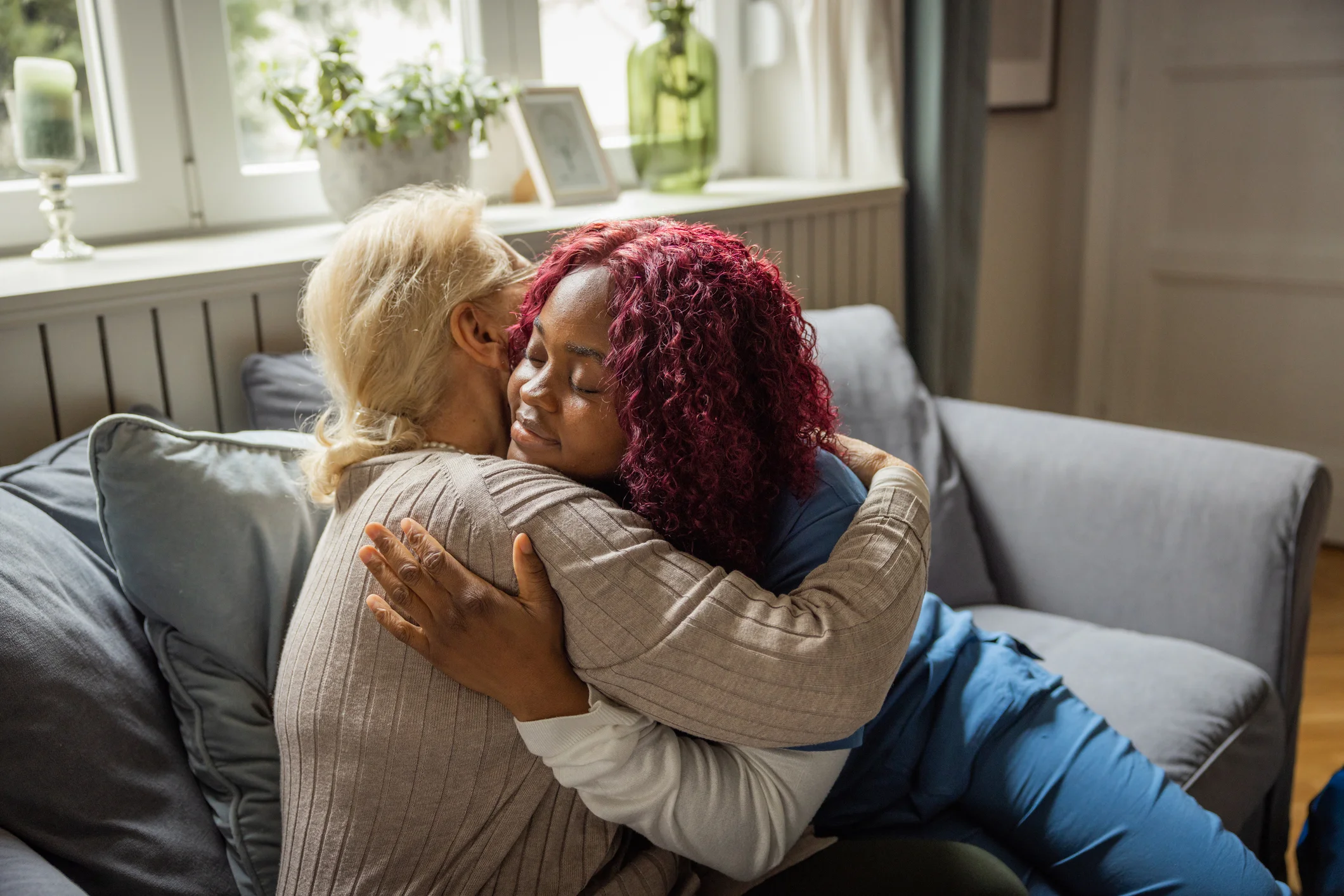 Care professional supporting a family at home while reviewing care options